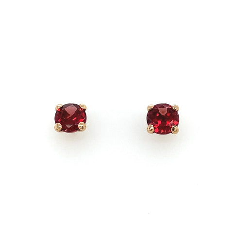 A pair of 9ct yellow gold red garnet stud earrings with gold metallic accents.