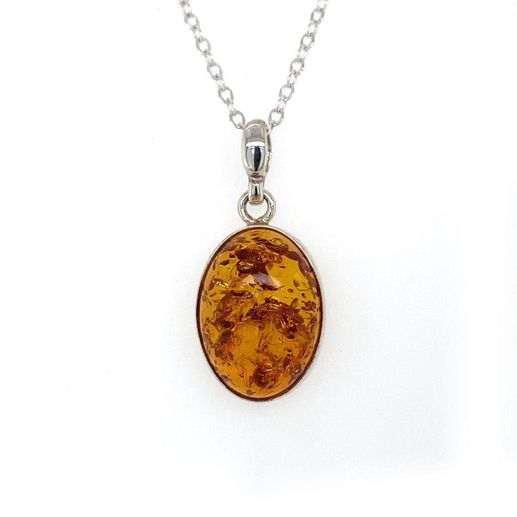  	Sterling Silver Oval Bezel Set Amber Pendant