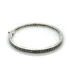  	Sterling Silver solid 4.5mm hinged Bangle set with marcasites. Inside diametre approx 56mm 