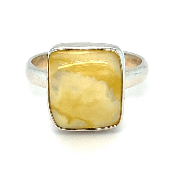 Light Pale Yellow Natural Butterscotch Amber Ring, bezel set in Sterling Silver. Fingersize R1/2